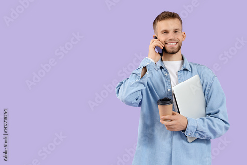 Handsome man with laptop an...