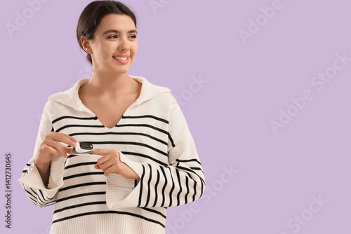 Young woman with pulse oxim...