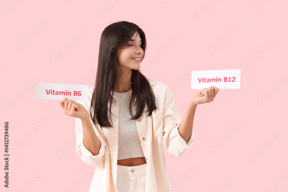 Young woman with vitamin B6 and B12 labels on pink background