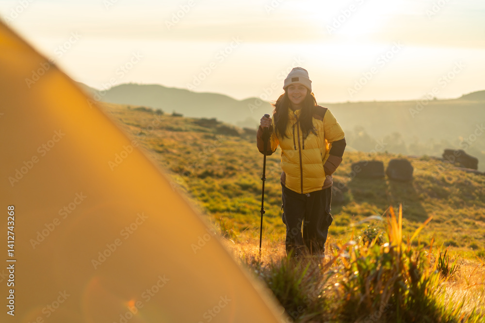 Hiker exploring scenic landscape at sunrise nature adventure outdoor serene wide view freedom