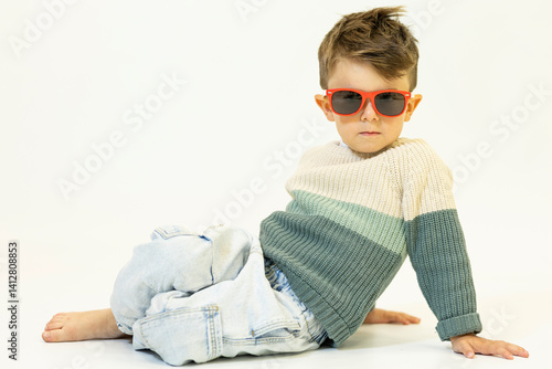 Happy caucasian children posing and playing in commercial studio with copy space