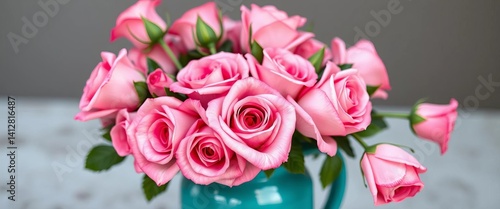 A vibrant bouquet of pink roses elegantly arranged in a turquoise ceramic vase, elegance, spring