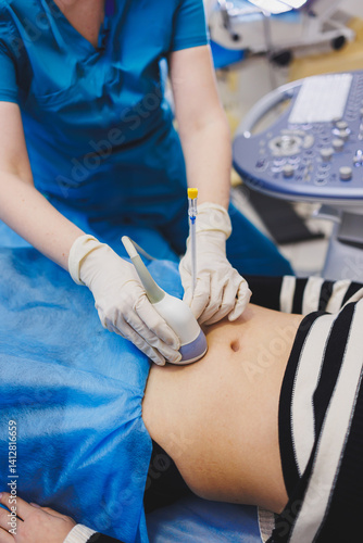 Shot of a pregnant woman during an ultrasound scan in a fertility clinic. Examination healthcare pregnancy gynecology people professionalism trust