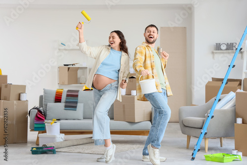 Happy pregnant couple with ...