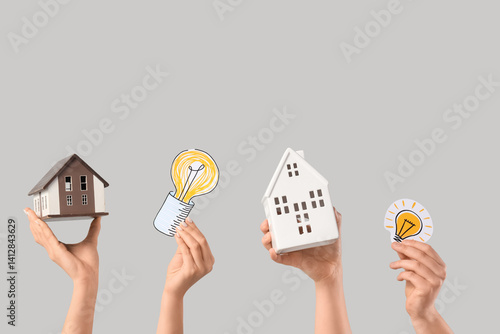 Female hands with house mod...