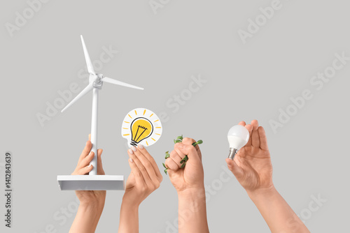 Female hands with wind turb...