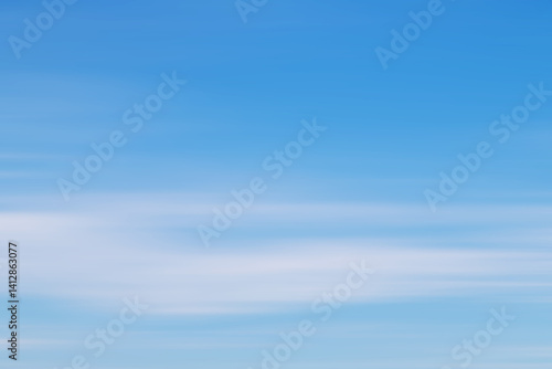 Obraz na płótnie Vivid Blue Sky with Gentle White Clouds Spreading Across the Horizon w salonie