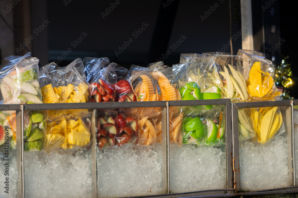 Street shop offers fresh chilled fruit, Thailand