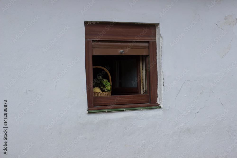 Fototapeta premium basket of fruit on a small window