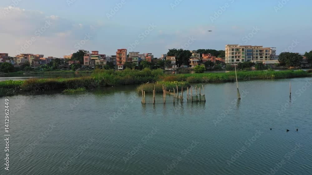 4k Video of Serene Views at Guangzhou Liuxi River During the Golden Hour Showcasing Vibrant Nature and Charming Architecture 4k Video of Serene Views at Guangzhou Liuxi River During the Golden Hour Showcasing Vibrant Nature and Charming Architecture