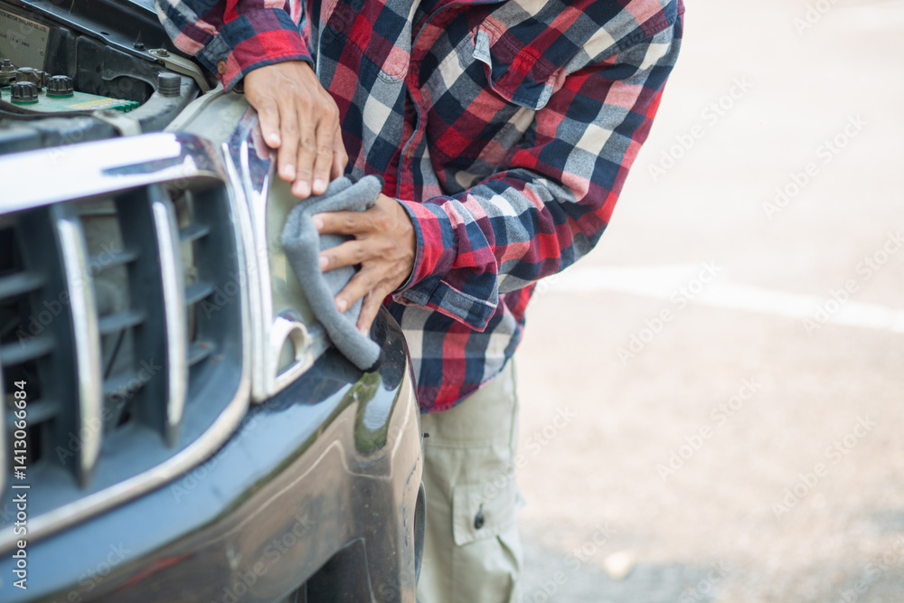 The man is checking the engine and condition of car to fix it properly and safely before traveling long distances. The man is checking condition of the car and the engine before traveling for safety. The man is checking the engine and condition of car to fix it properly and safely before traveling long distances. The man is checking condition of the car and the engine before traveling for safety.