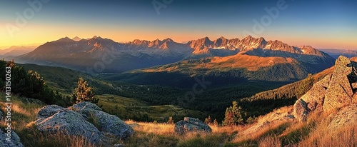Mountain sunrise grandeur. Peaks bathed in morning light symbolize adventure. Applications: outdoor gear ads, travel blogs, or environmental documentaries.