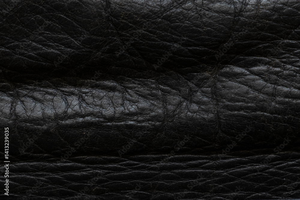 Fototapeta premium Black grain genuine leather as background, leather