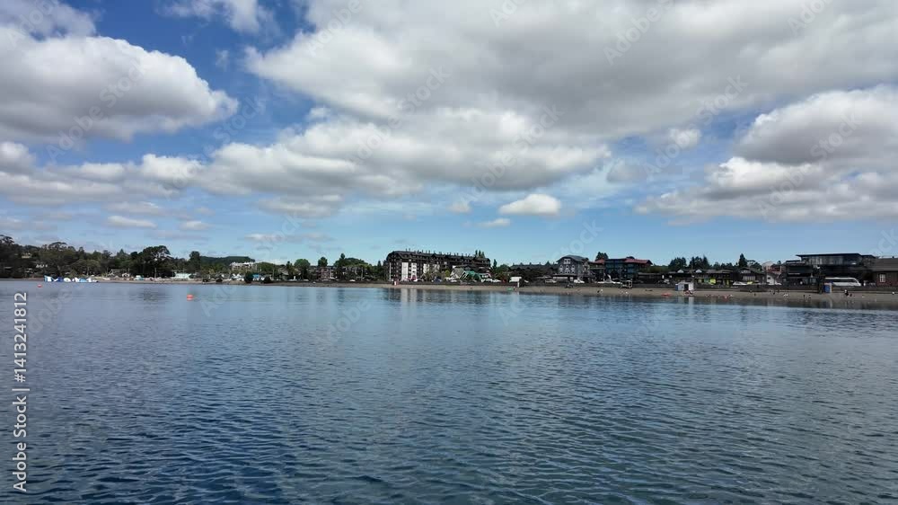 Scenic View of Calm Lake Llanquihue with Forested Shoreline Scenic View of Calm Lake Llanquihue with Forested Shoreline