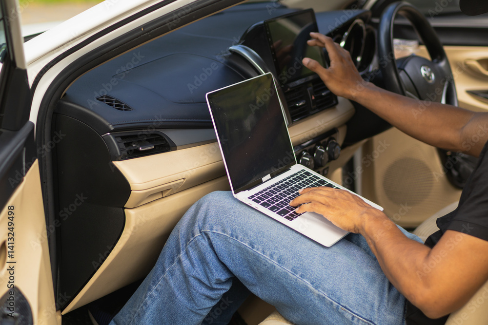 mechanic is using a computer to check the system of the control box inside the car to tune and fix car faults after checking. Concept of using a computer to check read data and fix the car faults. mechanic is using a computer to check the system of the control box inside the car to tune and fix car faults after checking. Concept of using a computer to check read data and fix the car faults.