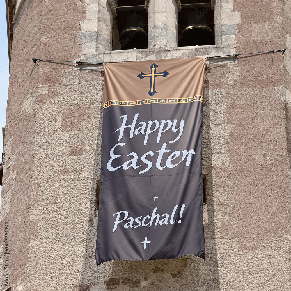 Vibrant Paschal Banner Adorning Historic Bell Tower with Easter Greetings