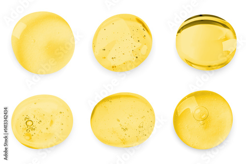 Obraz na płótnie Drops of golden serum on white background, set w salonie