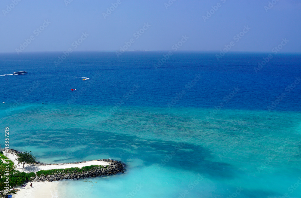 Sunny tropical beach paradise on the Maledives