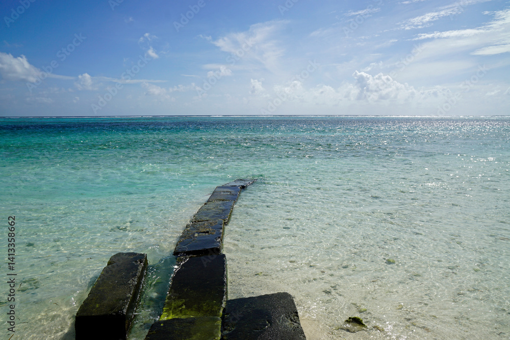 Jetty at Sunny tropical beach paradise on the Maledives