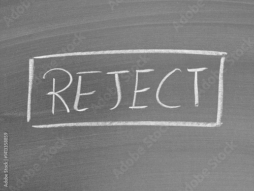 Chalkboard with the word REJECT outlined in a rectangle, concept for denial, refusal, decline and disapproval.