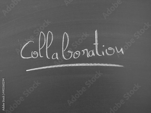 The word Collaboration is written in chalk on a chalkboard. The word is underlined with a thin chalk line for emphasis.