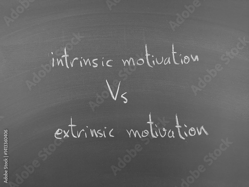 Intrinsic vs Extrinsic Motivation: A chalkboard contrasts internal drive with external rewards in motivation and behavioral science.