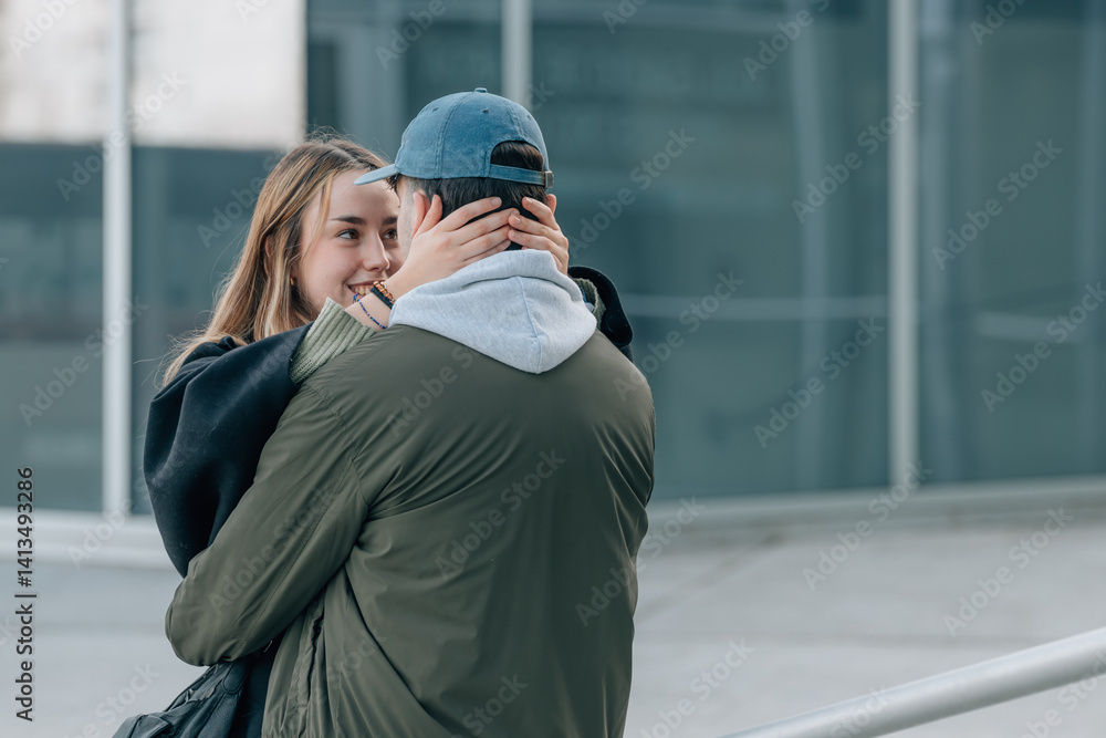 couple of boy and girl on the street outdoors hugging