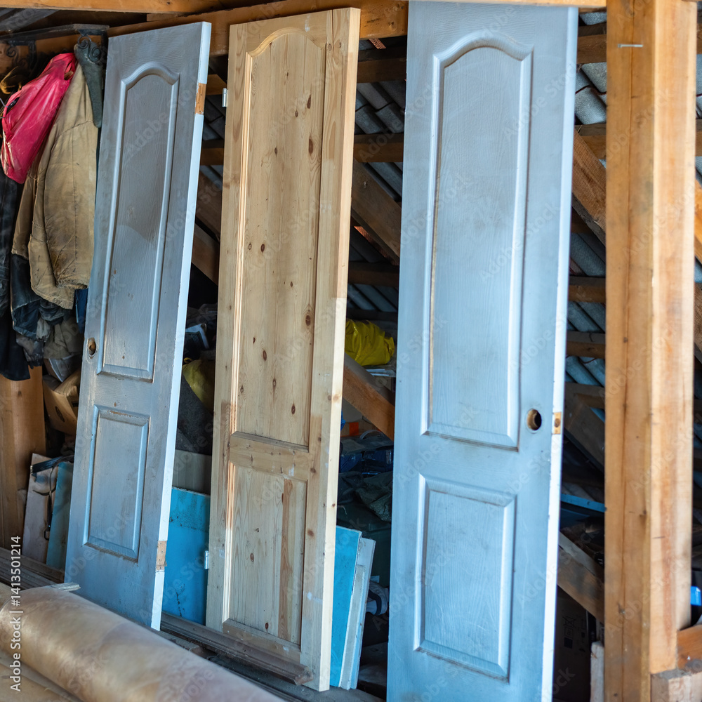 Interior doors stored in an attic.