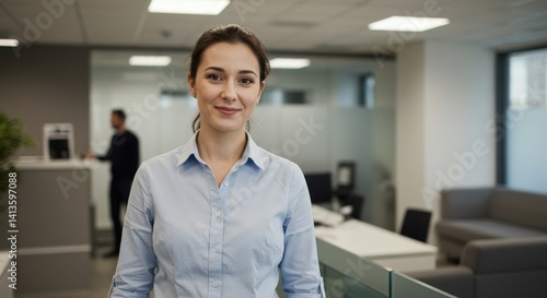 Wallpaper Mural Woman in light blue shirt smiling in modern office with glass partitions and natural light Torontodigital.ca