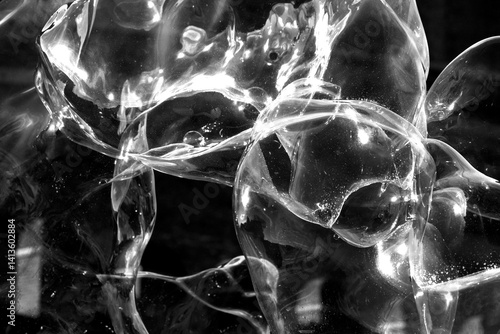 Φωτογραφία abstract image of large white blown bubbles against black