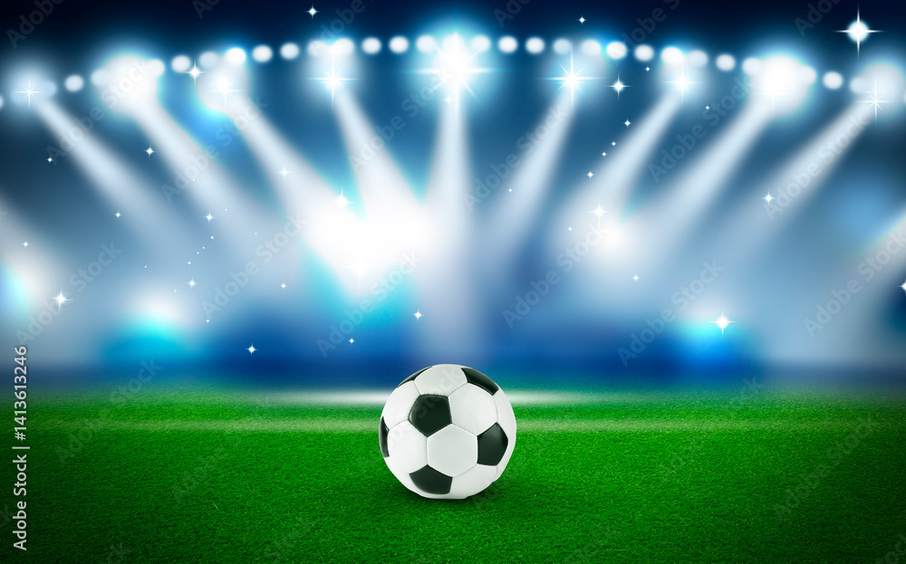 Naklejka premium Soccer ball on green grass at stadium. Football game
