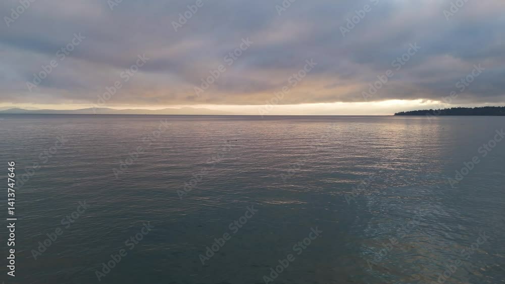 Sunrise Over Calm Ocean on Vancouver Island, British Columbia Sunrise Over Calm Ocean on Vancouver Island, British Columbia