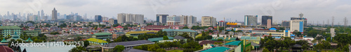 Cityscape Panorama with Buildings and Skyline Under Overcast Sky Daytime