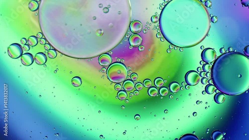 Colorful Oil Bubbles Moving on a Water Surface