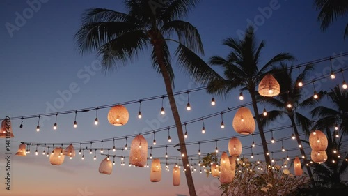 sunset romantic wedding dinner. New Year's bulb of garland and Christmas decoration.
