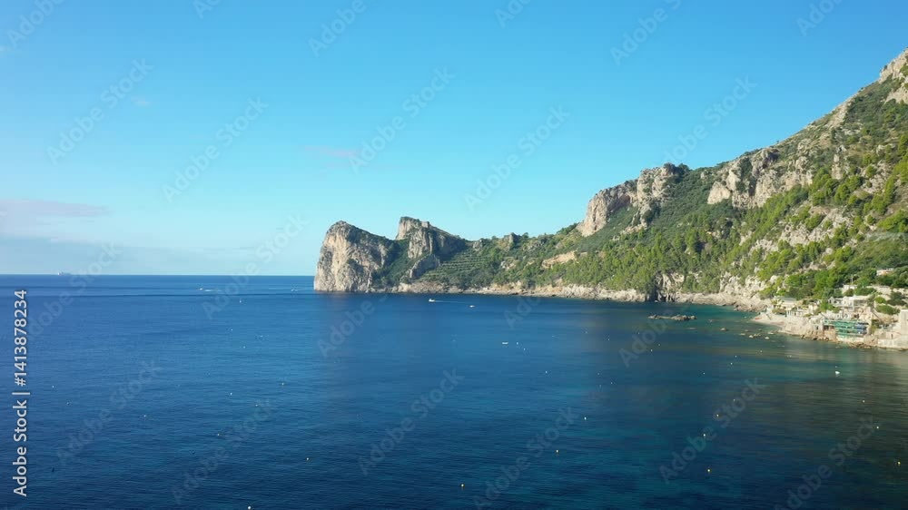 The seaside village of Marina del Cantone in Europe, Italy, Campania, in summer, on a sunny day. The seaside village of Marina del Cantone in Europe, Italy, Campania, in summer, on a sunny day.
