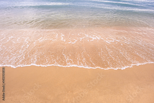 Nature of the beach and sea Summer with sunshine, sandy beaches, clear blue waters sparkling against the blue sky. On an island with good ecology and environment Background for summer vacation