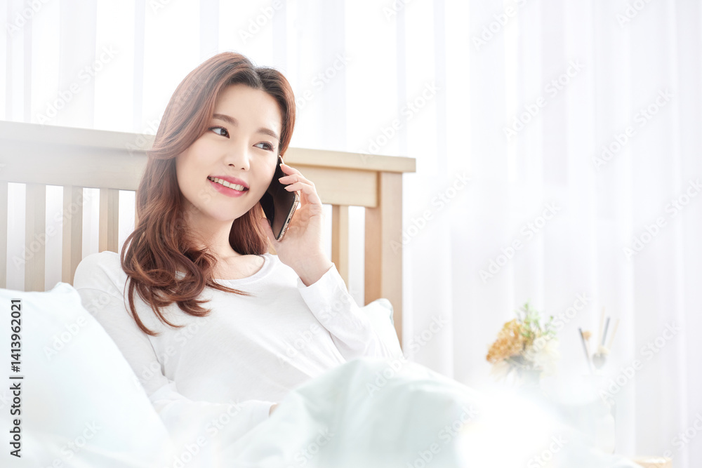 Woman Talking on Phone in Bed, Bright Morning Woman Talking on Phone in Bed, Bright Morning