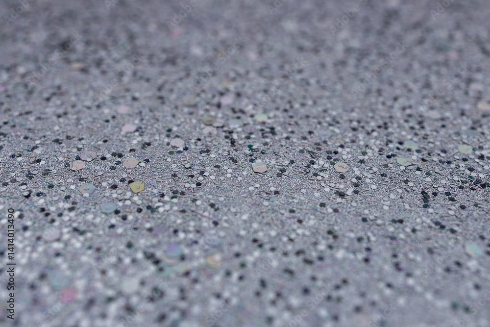 Full frame macro abstract texture background of defocused silvery black glitter surface with copy space Full frame macro abstract texture background of defocused silvery black glitter surface with copy space