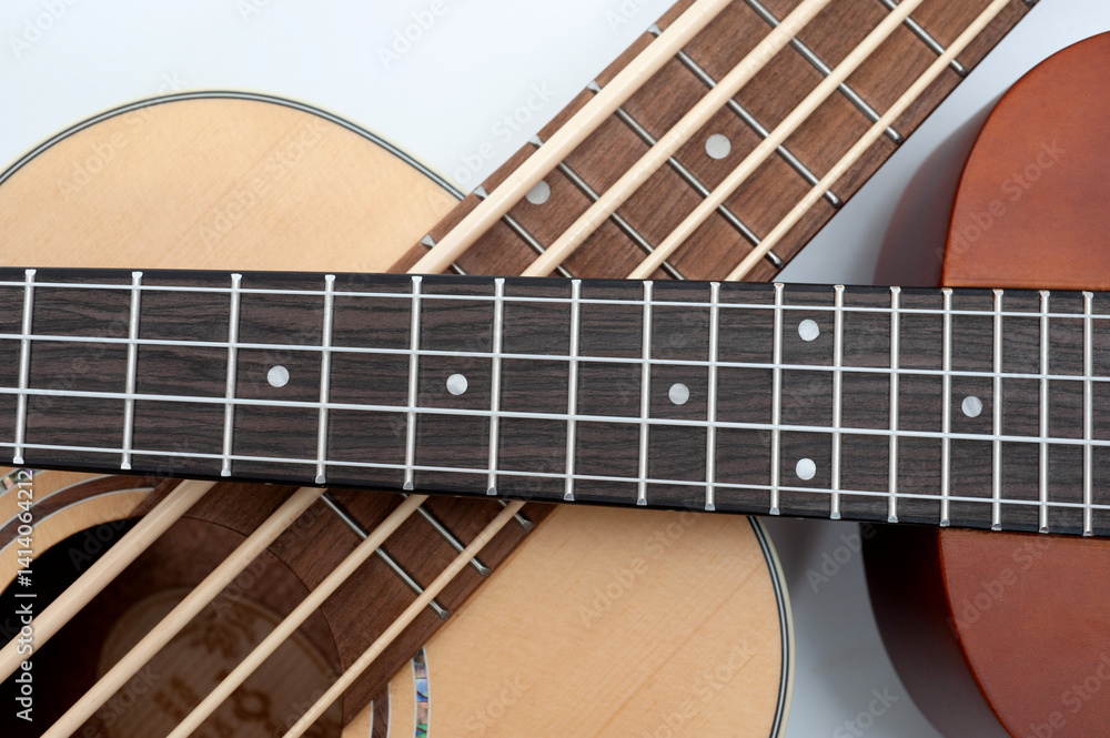 Obraz premium Four-string bass ukulele with wooden body and built-in tuner and pickup.