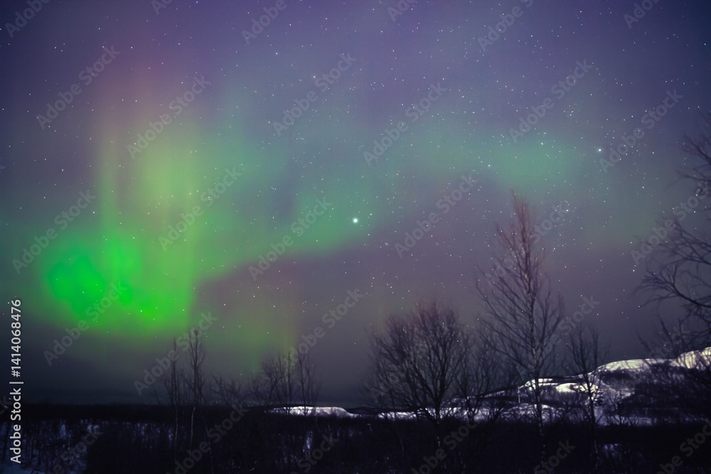 Aurora borealis, polar lights with Milky Way stars.