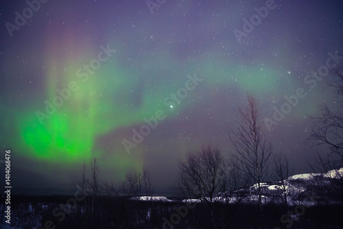 Obraz na płótnie Aurora borealis, polar lights with Milky Way stars. w salonie