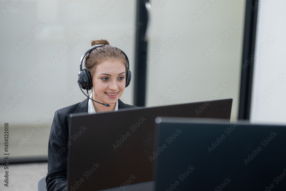 Young professional assisting clients remotely while smiling in a modern office environment during work hours Young professional assisting clients remotely while smiling in a modern office environment during work hours