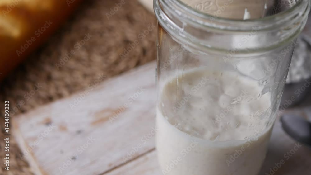 Fermenting Sourdough Starter Wild Yeast in a Kitchen Jar. Fermenting Sourdough Starter Wild Yeast in a Kitchen Jar.