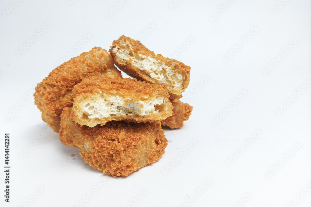 Fried tofu or crispy tofu fried in seasoned flour. Isolated on white background Fried tofu or crispy tofu fried in seasoned flour. Isolated on white background
