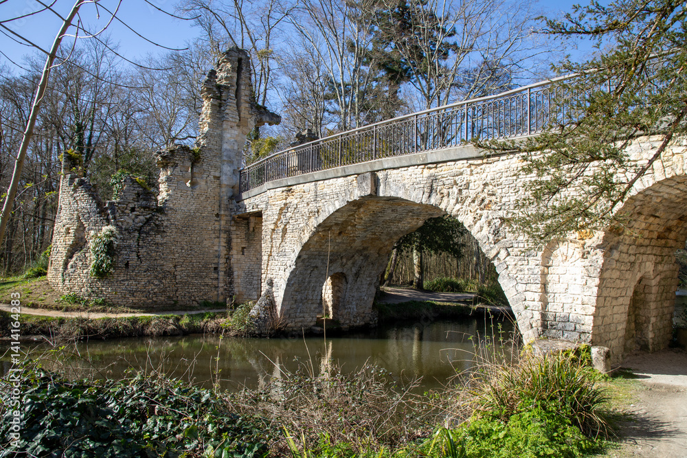 old bridge over the river stone ancient inside park of Majolan at Blanquefort city France