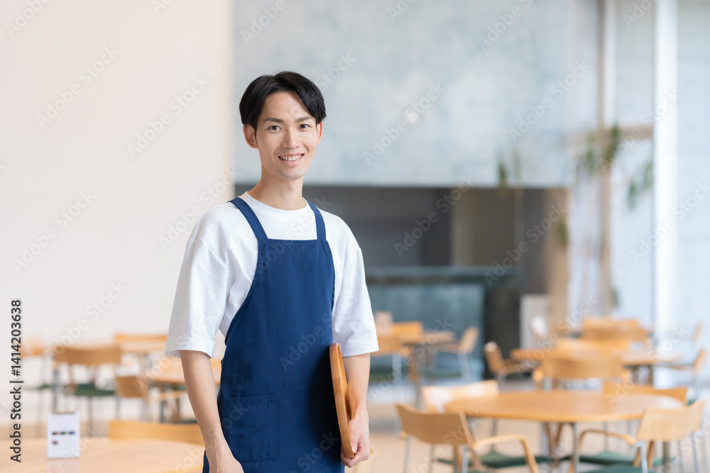 Fototapeta premium カフェで働く若いの店員