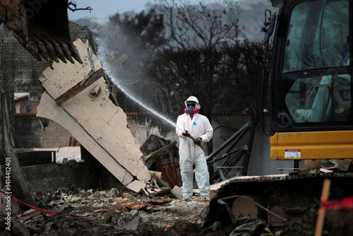 U.S. Army Corps of Engineer Contractor Hoses Down Dust During Debris Removal Following Palisades Fire in Pacific Palisades Los Angeles California