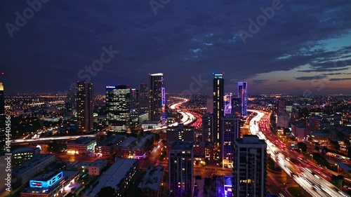 Wallpaper Mural Aerial night view of illuminated cityscape with vibrant highway light trails, dynamic urban landscape showing transportation network and modern skyscrapers Torontodigital.ca