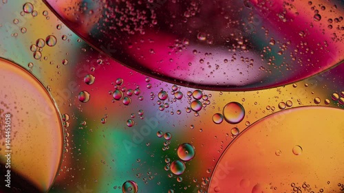 Colorful Oil Bubbles Moving on a Water Surface